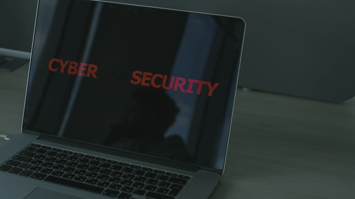 A laptop screen displaying the words cyber security